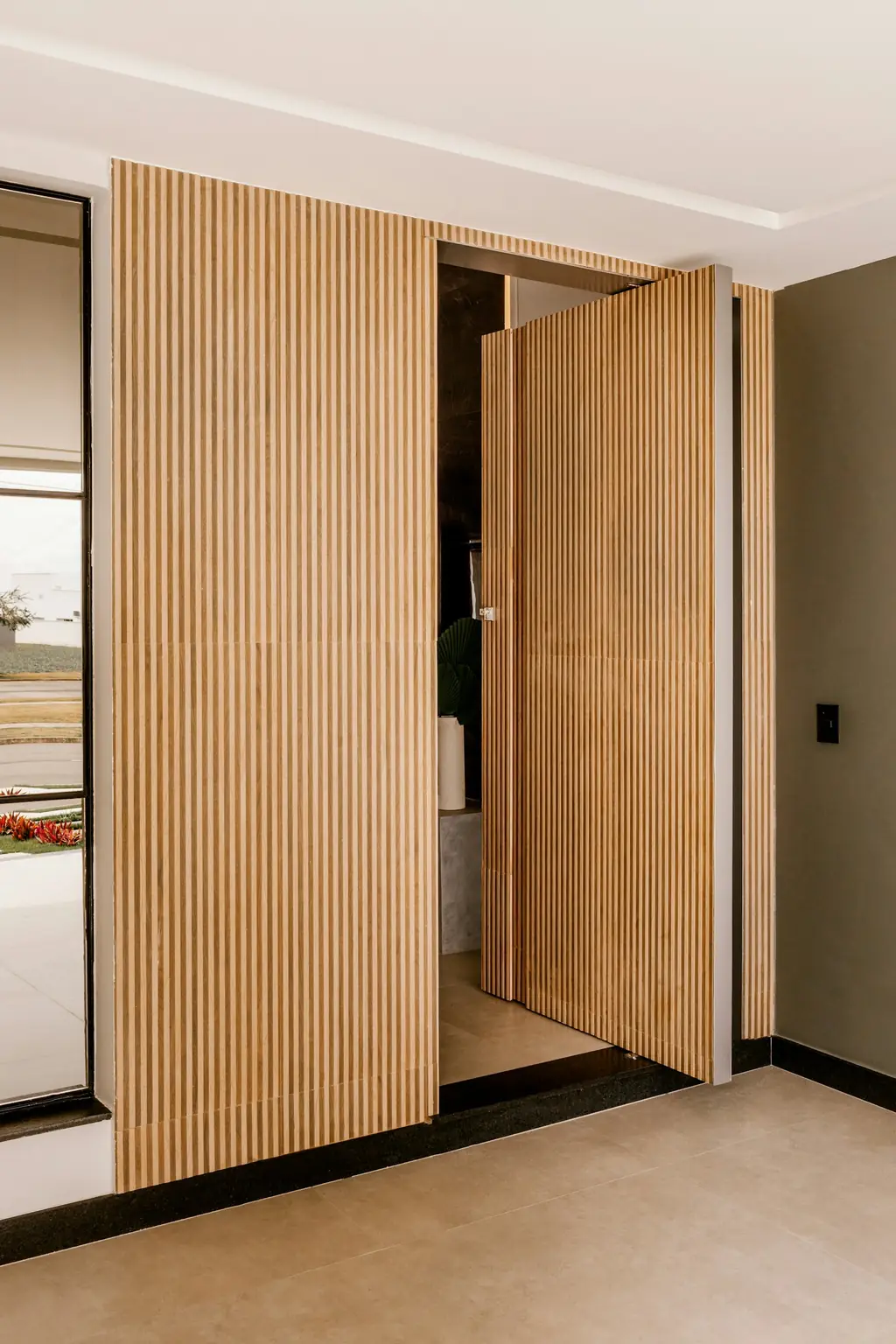 Modern wooden slatted door in an interior