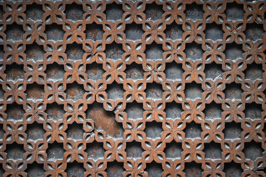 Wooden lattice panel with repeating floral pattern